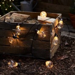 Guirlande Guinguette Core Connect 30 M 60 Ampoules Blanc Chaud Câble Noir Raccordable 11 Guirlande Guinguette Core Connect 30 M 60 Ampoules Blanc Chaud Câble Noir Raccordable -Noel Deco Magasin guirlande guinguette core connect allumees posees sur boite en bois 255d54af 4b7b 4cd2 8592 18d608c846dc